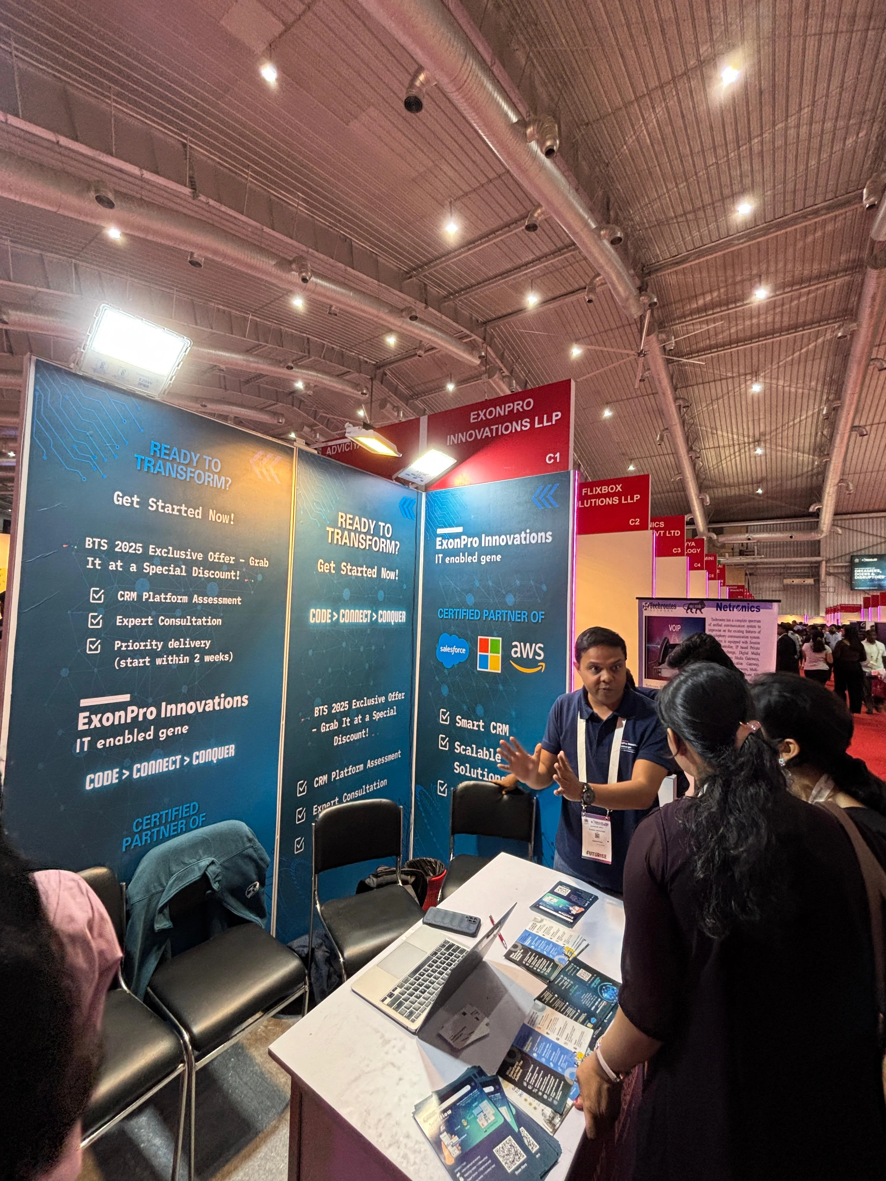 ExonPro team explaining solutions at BTS